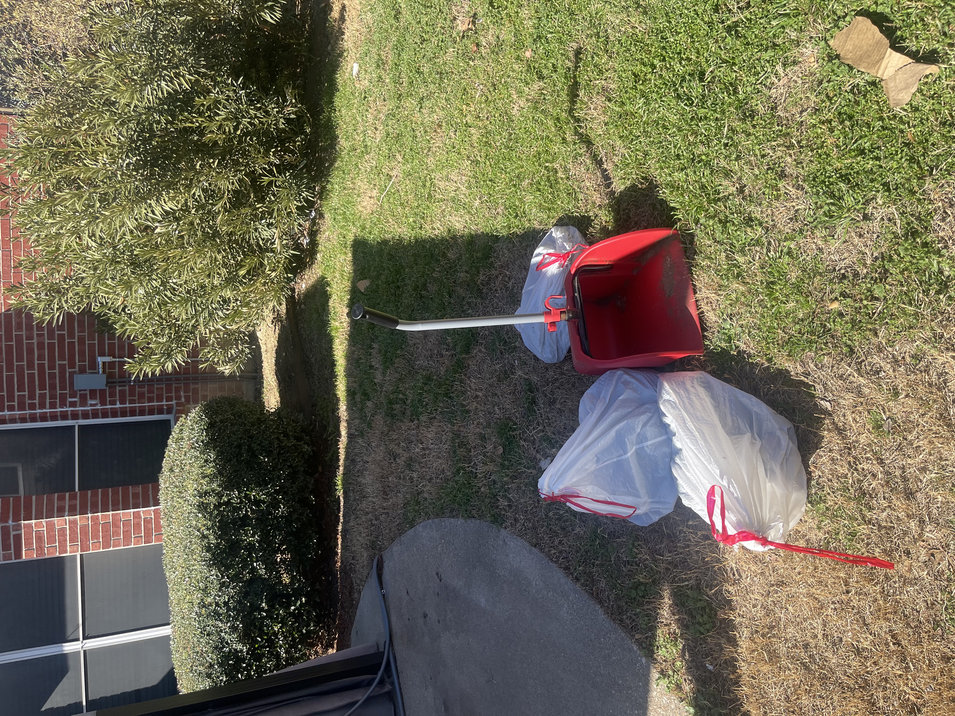 Overhead view of completed A1 Scoop Warriors dog poop removal service on a green suburban yard
