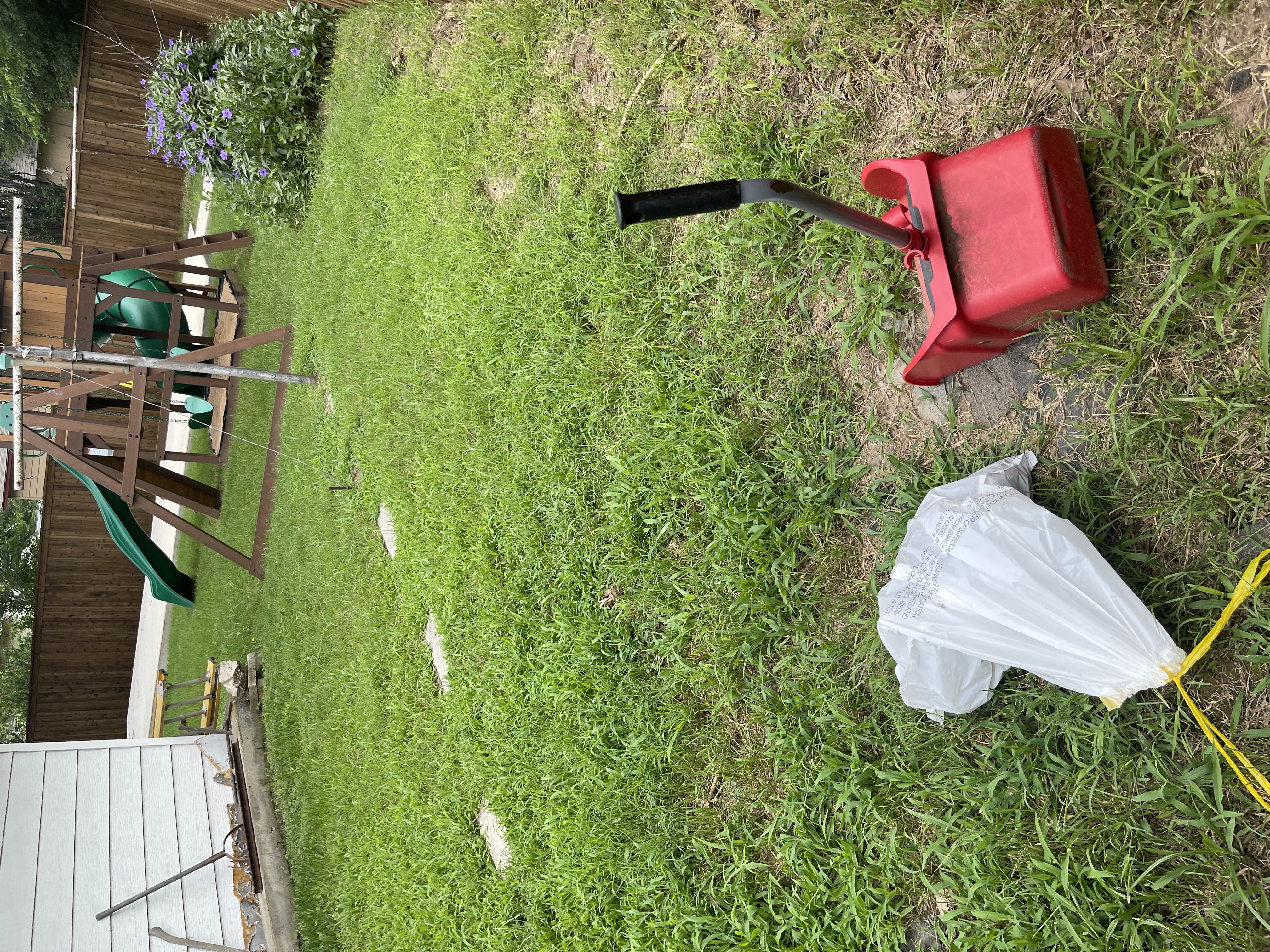 A1 Scoop Warriors pet waste removal completed in a backyard with children's swing set and slide